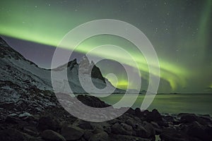 Aurora Borealis Northern Lights above Mountains in Iceland