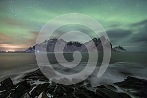 Aurora Borealis Northern Lights above Stokksnes Beach and Vestrahorn Mountains, Iceland