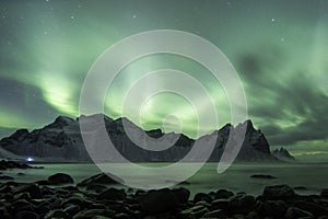 Aurora Borealis Northern Lights above Stokksnes Beach and Vestrahorn Mountains, Iceland