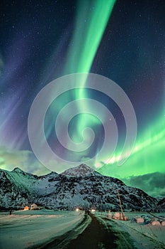 Aurora Borealis, Northern Lights explosion over mountain on winter at Flakstad, Lofoten islands