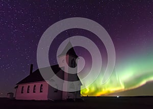 Aurora Borealis Northern Lights over Historical Church near Cabri, Saskatchewan, Canada photo