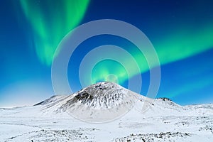 Aurora Borealis. Northern Lights over the mountains. Scandinavia.