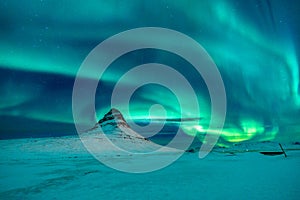 Aurora Borealis over Kirkjufell mountain in Iceland