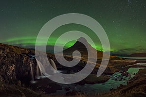 Aurora Borealis over Kirkjufellsfoss and Kirkjufell mountain