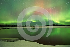 Aurora Borealis over lake