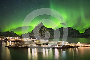 Aurora borealis over a village on the Lofoten in Norway