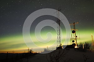 Aurora Borealis and twilight over antenna complex