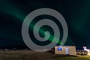 Aurora borealis in village of Hrisey in North Iceland