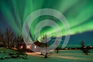 Aurora over cottage in Iceland