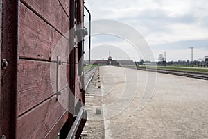 Main entrance to Auschwitz Birkenau Nazi Concentration Camp, showing one of the cattle cars used to bring victims to their death