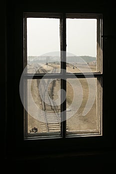 AUSCHWITZ, POLAND - March 30 2012 Melancholic view through a window of a concentration camp railway selection platform