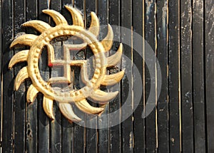 An auspicious swastika symbol on a door photo