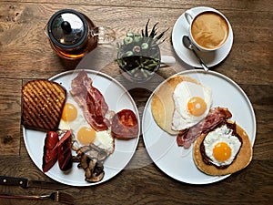 Aussie / Australian Breakfast with Brioche Toast, Fried Eggs, Crispy Bacon Sausage, Salty Pancakes and Mushrooms