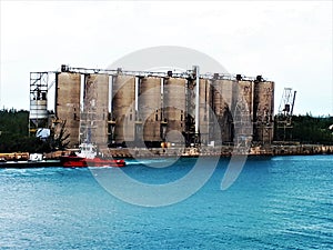 Austere , grey cement silos at FreePort harbour, Bahamas