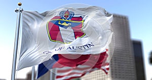 Austin city flag waving in the wind with Texas state and United States national flags