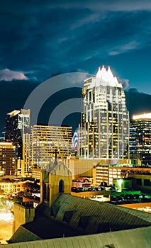 Austin night cityscape with church and skyscrapers