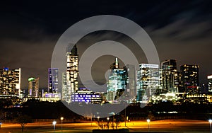 Austin skyline at night with bright illuminated buildings