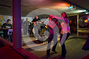 Country music band playing and people dancing in the Broken Spoke dance hall in Austin, Texas