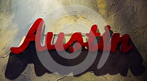 Austin Texas Metal Sign Hanging on Textured Wall photo