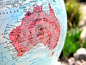 Australia Continent focus macro shot on globe map for travel blogs, social media, website banners and backgrounds.