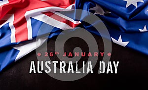 Australia day concept. Australian flag against dark stone background. 26 January