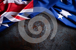 Australia day concept. Australian flag with the text Happy Australia day against a black stone texture background. 26 January