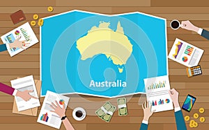 Australia economy country growth nation team discuss with fold maps view from top