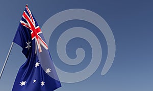 Australia flag on flagpole on blue background. Place for text. The flag is unfurling in wind. Canberra, Sydney. Oceania. 3D