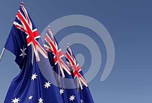 Australia flag on flagpole on blue background. Place for text. The flag is unfurling in wind. Canberra, Sydney. Oceania. 3D