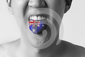 Australia flag painted in tongue of a man - indicating English language and Australian accent speaking