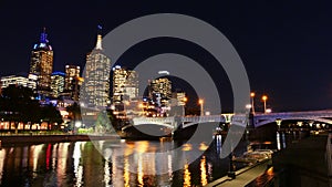 Australia, Victoria, Melbourne downtown and Yarra river at night time. Space for text