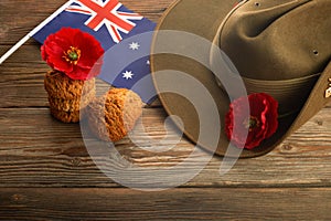 Australian Anzac Day. Australian army slouch hat and traditional Anzac biscuits on wooden background.