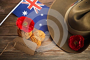 Australian Anzac Day. Australian army slouch hat and traditional Anzac biscuits on wooden background.