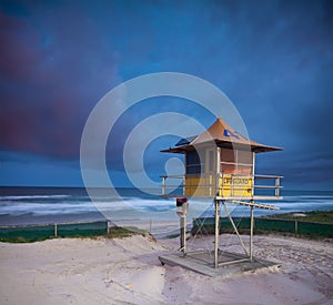 Australian beach at twilight with lifeguard