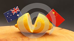 Australian and Chinese flags on a cut lemon. International relations sour