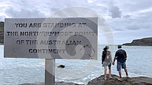 Australian couple stand at the Northernmost Point of the Australian Continent