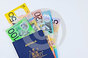 Australian currency dollars cash banknotes an Australian passport with a white background