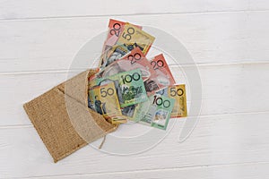 Australian dollar banknotes with material envelope on light background