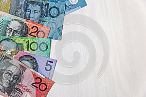 Australian dollar banknotes on wooden