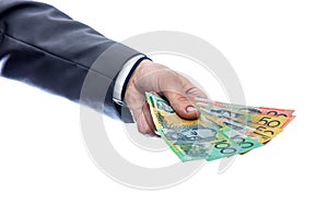 Australian dollars in male hand isolated on white