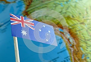 Australian flag with a globe map as a background