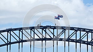 Australian flags flay above Sydney Harbour Bridge