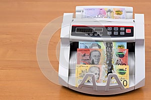 Australian money in a counting machine