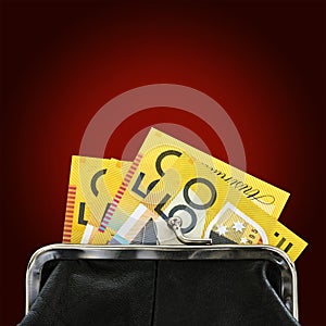 Australian Money in Purse over Red Background