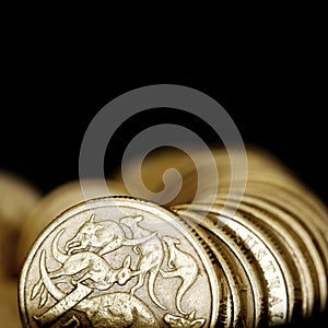 Australian One Dollar Coins over Black