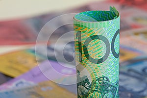 Australian one hundred dollar note in a roll.