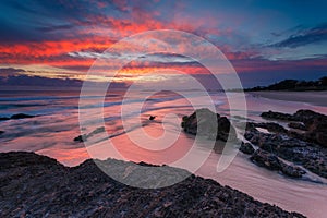 Australian seascape at sunrise with rich in red color