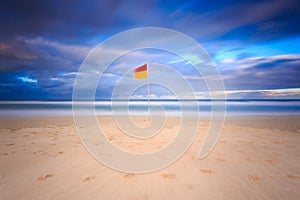 Australian seascape with surf flag