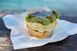 Australian traditional meat pie with Woolloomooloo bay on the ba