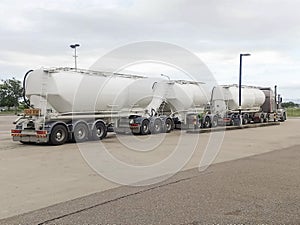 Australian truck trailer , hopper or bulk road train.Transportation and logistics with long vehicle three trailer